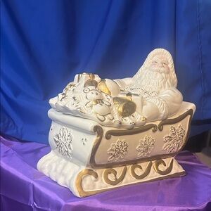 Vintage Ceramic Santa in Sleigh Figurine Cookie Jar opens up to store cookies
